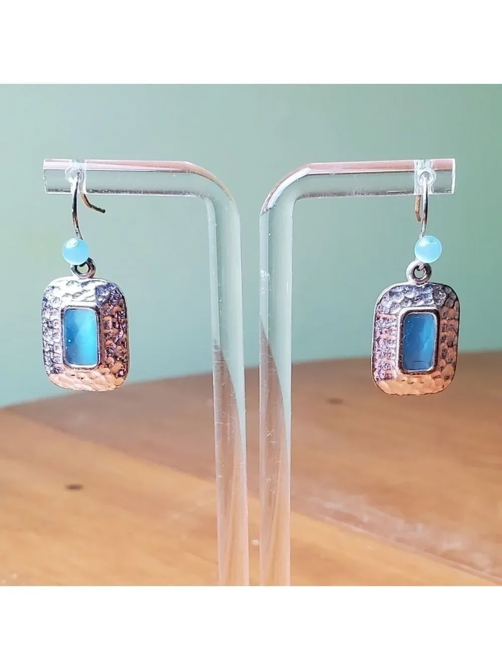 NWOT earrings, silver colored with light blue stone